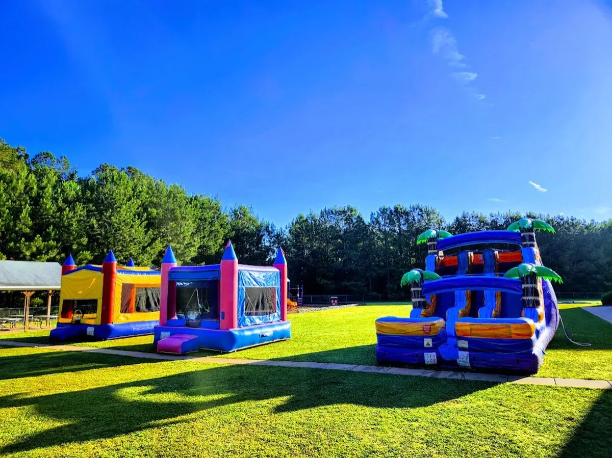 Wow Inflatables large inflatable water park rental with multiple slides at community festival in Middle Georgia