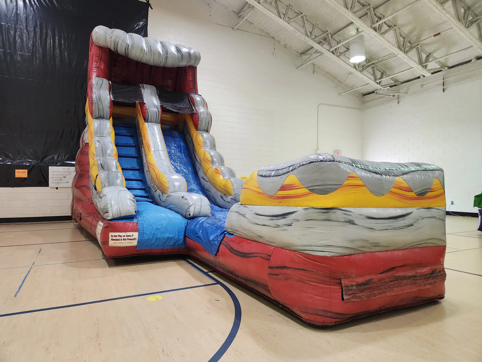 Wow Inflatables bounce house rental at outdoor party in Georgia — inflatable bounce house with kids playing at summer event