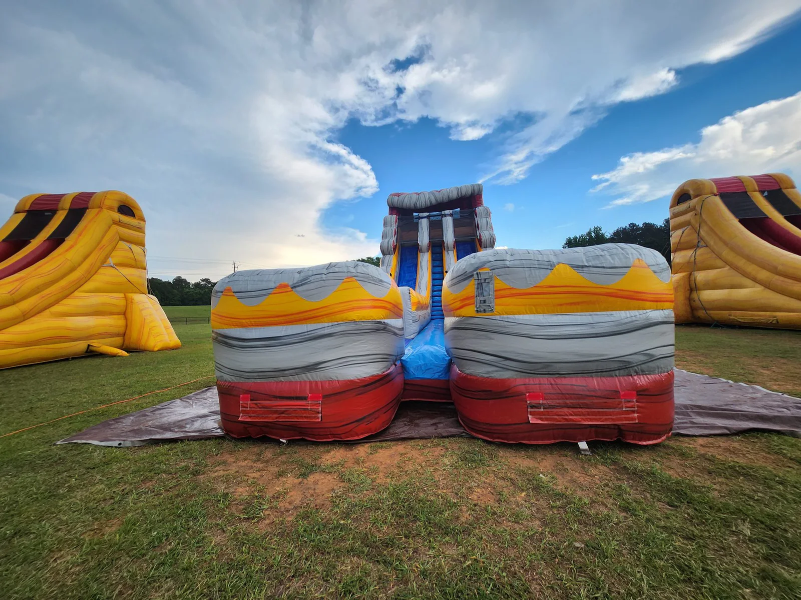 Wow Inflatables inflatable rental at outdoor event in Middle Georgia — party rental setup at community or corporate event