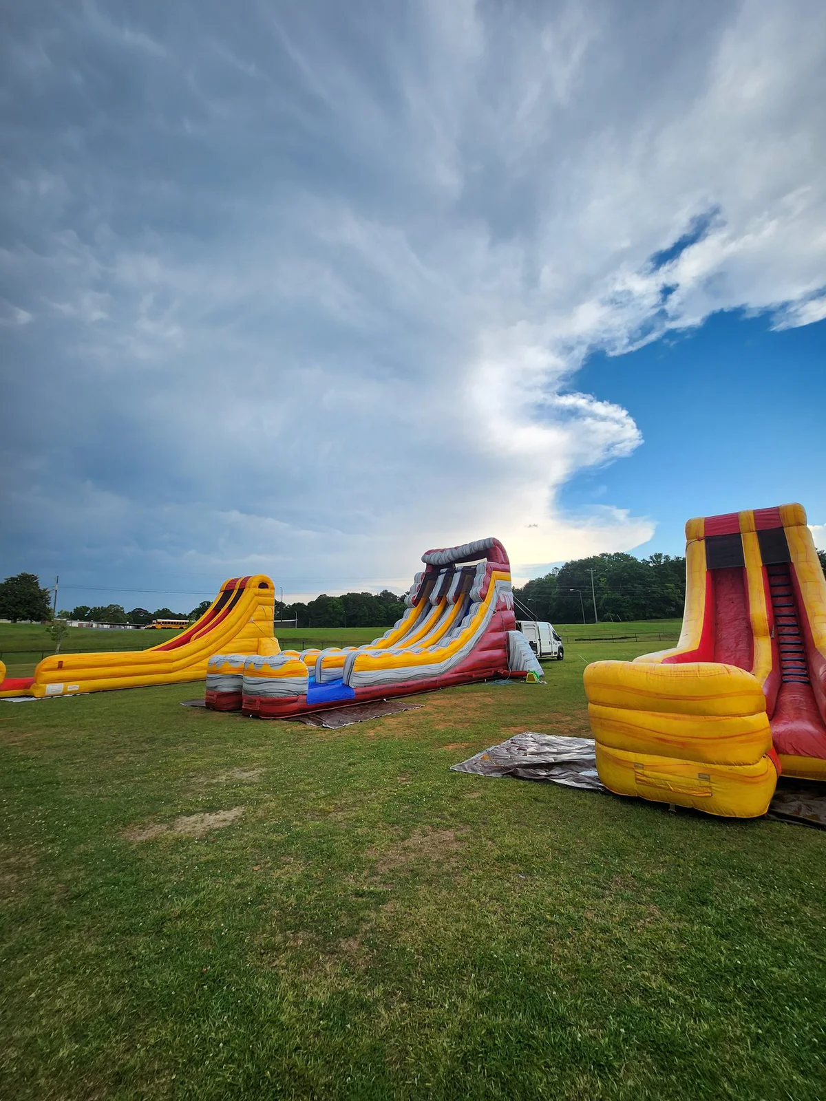 Wow Inflatables party rental in Georgia — inflatable bounce house or water slide at outdoor birthday party or community event