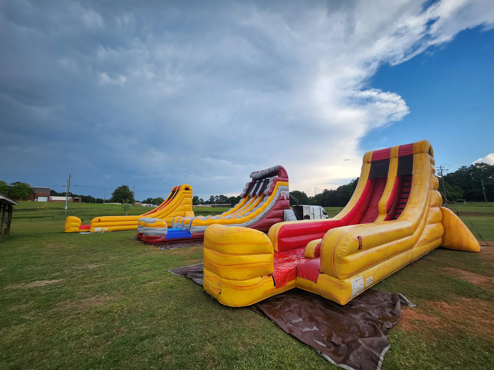 Wow Inflatables inflatable party rental at outdoor event in Georgia — bounce house water slide or combo unit at summer party