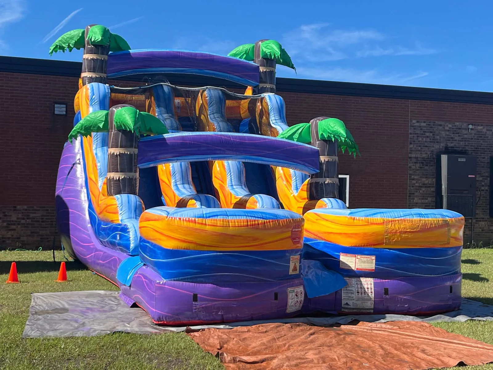 Wow Inflatables inflatable rental fun at outdoor party in Georgia — kids enjoying bounce house or water slide at birthday celebration