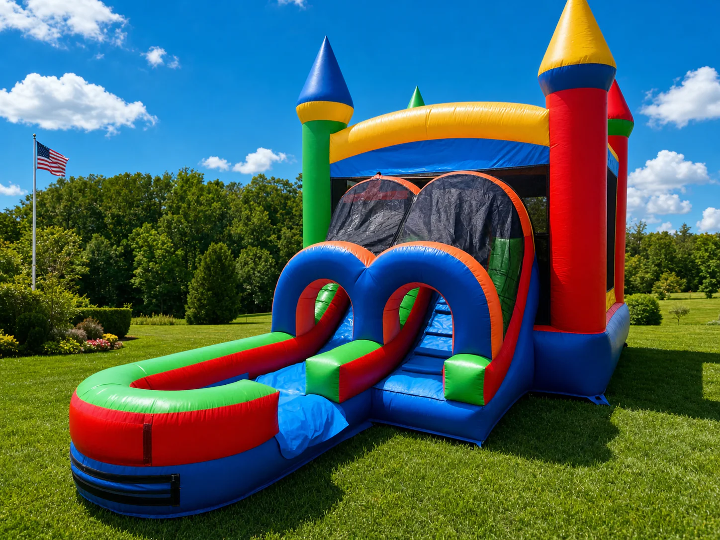Wow Inflatables colorful castle combo bounce house water slide rental with splash pool side view at outdoor birthday party in Georgia
