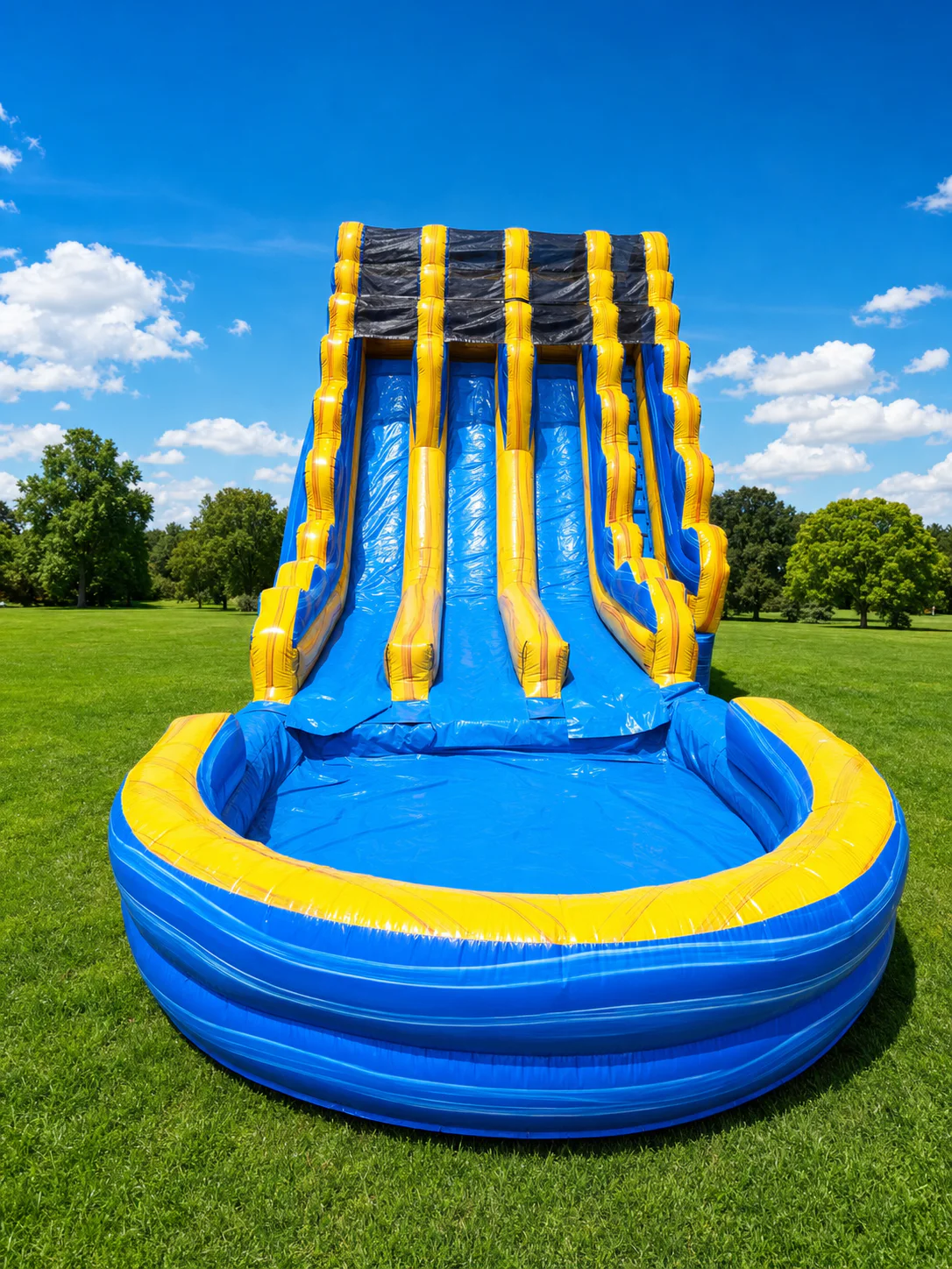 Wow Inflatables triple lane blue and yellow inflatable water slide rental front view at outdoor event in Middle Georgia — giant water slide with splash pool