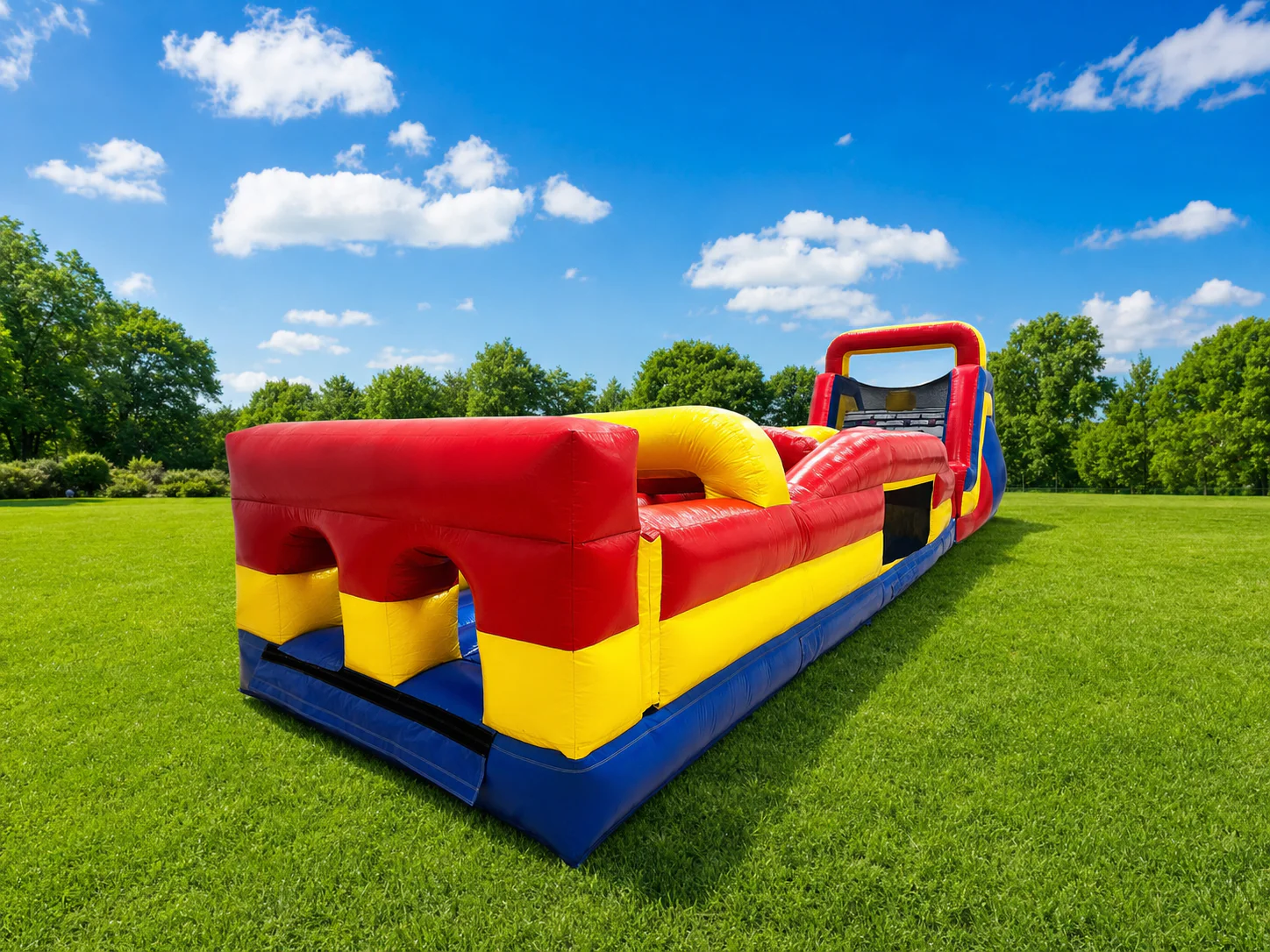 Wow Inflatables red yellow blue inflatable obstacle course rental entry section side view at outdoor event in Georgia — large obstacle course