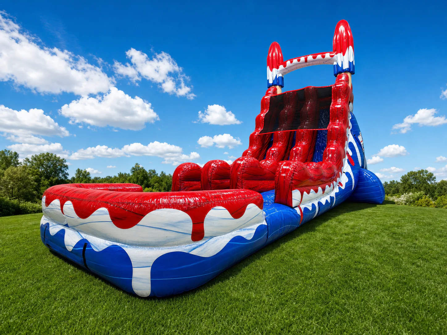 Wow Inflatables patriotic red white and blue inflatable water slide rental angle view at outdoor 4th of July event in Georgia