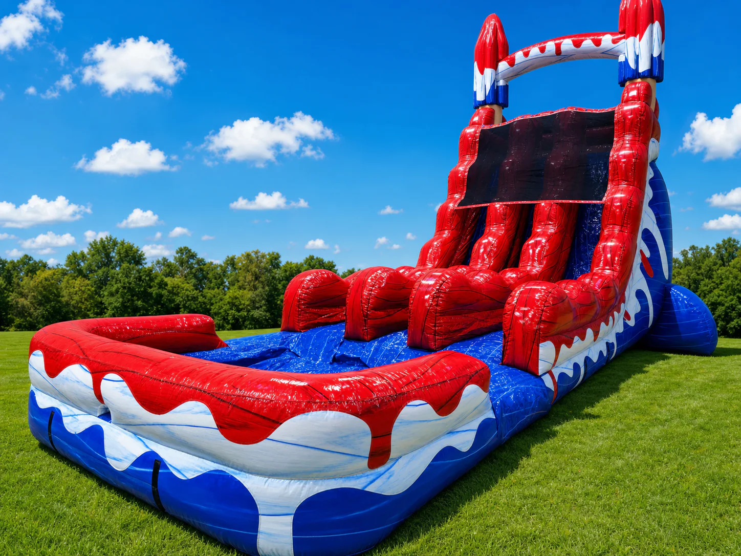 Wow Inflatables patriotic red white and blue inflatable water slide rental side view at outdoor summer event in Middle Georgia