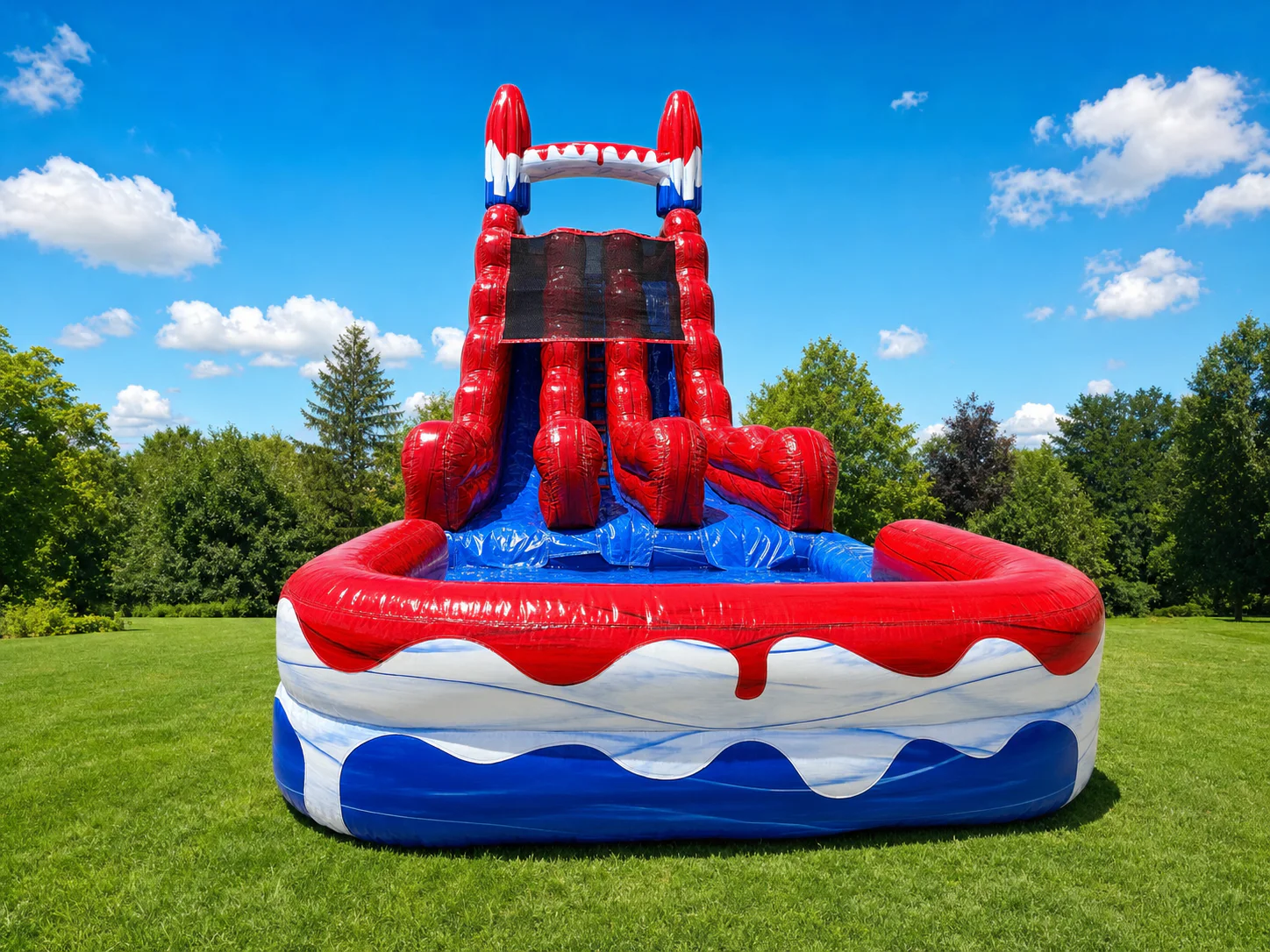 Wow Inflatables patriotic red white and blue inflatable water slide rental front view with splash pool at outdoor event in Georgia — Labor Day Memorial Day rental