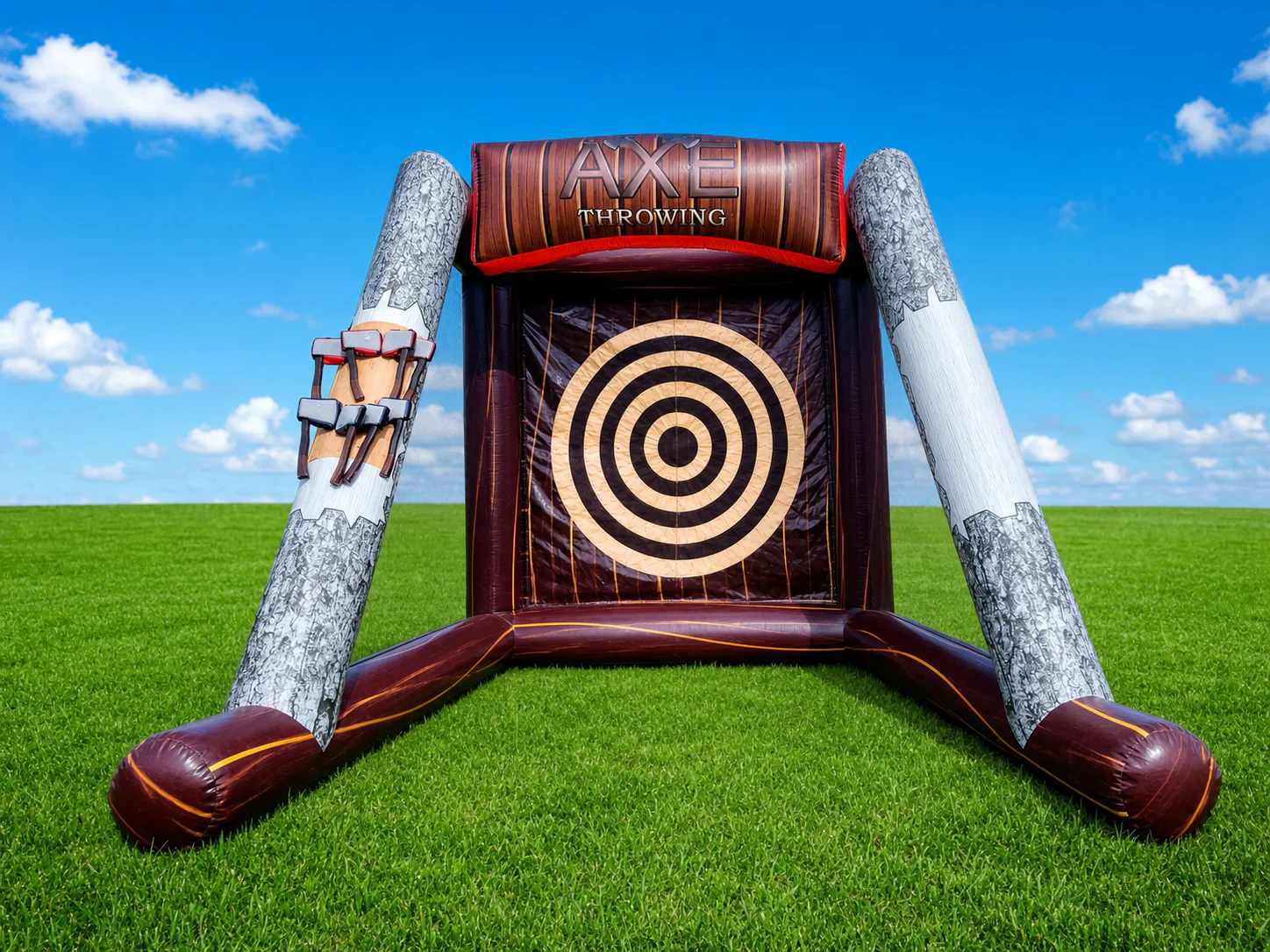 Wow Inflatables inflatable axe throwing game rental on green grass at outdoor event in Middle Georgia — corporate event and birthday party rental