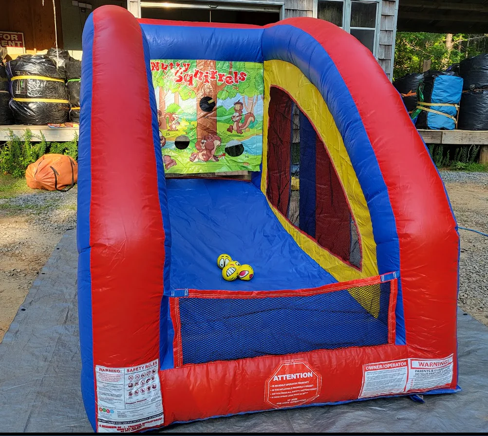 Wow Inflatables Nutty Squirrels inflatable carnival game rental at school event in Georgia — red and blue interactive target toss game for kids and adults