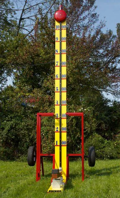 Wow Inflatables high striker strength tester carnival game rental at school carnival in Georgia — yellow and red inflatable high striker for kids and adults