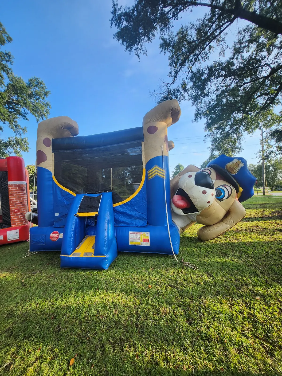 Owner-supplied photo of a blue police dog themed inflatable bounce house for Middle Georgia party rentals